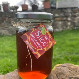 Frasco de miel de abejas Siloé con etiqueta artesanal.